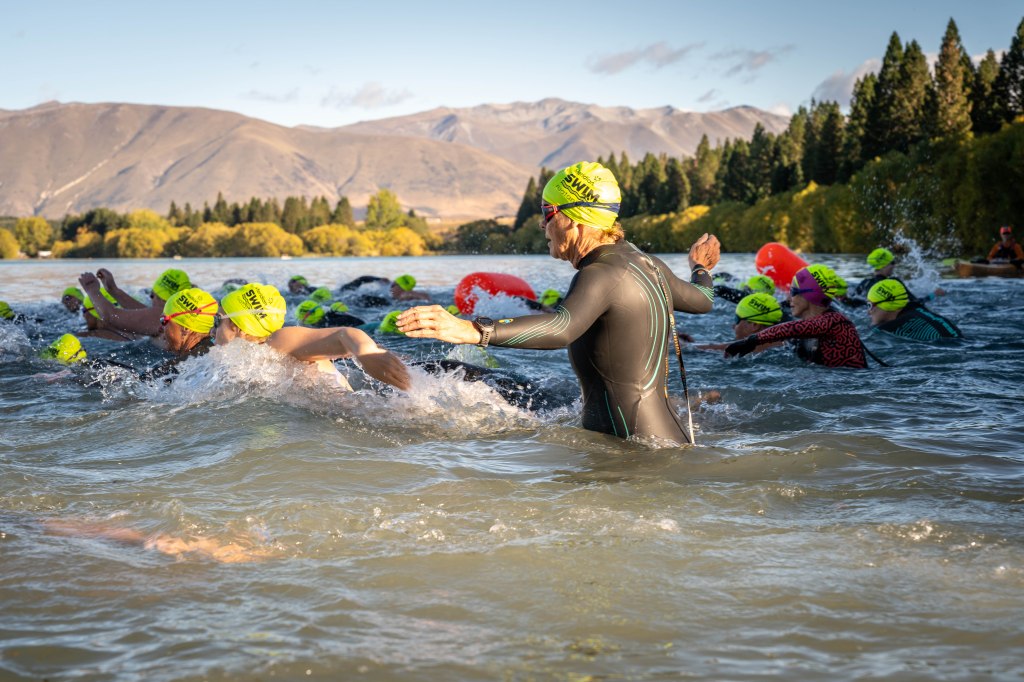 1,500m swimmers starting the race with the Ben Ohau range in the background.