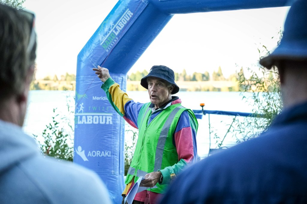 Arno the race director briefing the swimmers and pointing out the course.